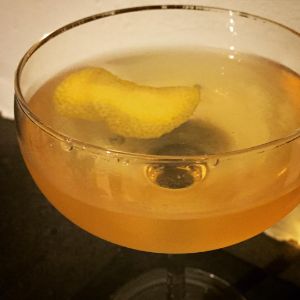 An image of the Woolworth cocktail submitted by n0tquitethere that contains Blended Scotch, Manzanilla Sherry, Benedictine DOM, Orange Bitters and Lemon